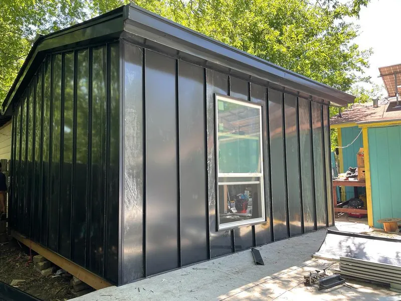 Black standing seam metal wall panels for Roof Inspection in Clinton